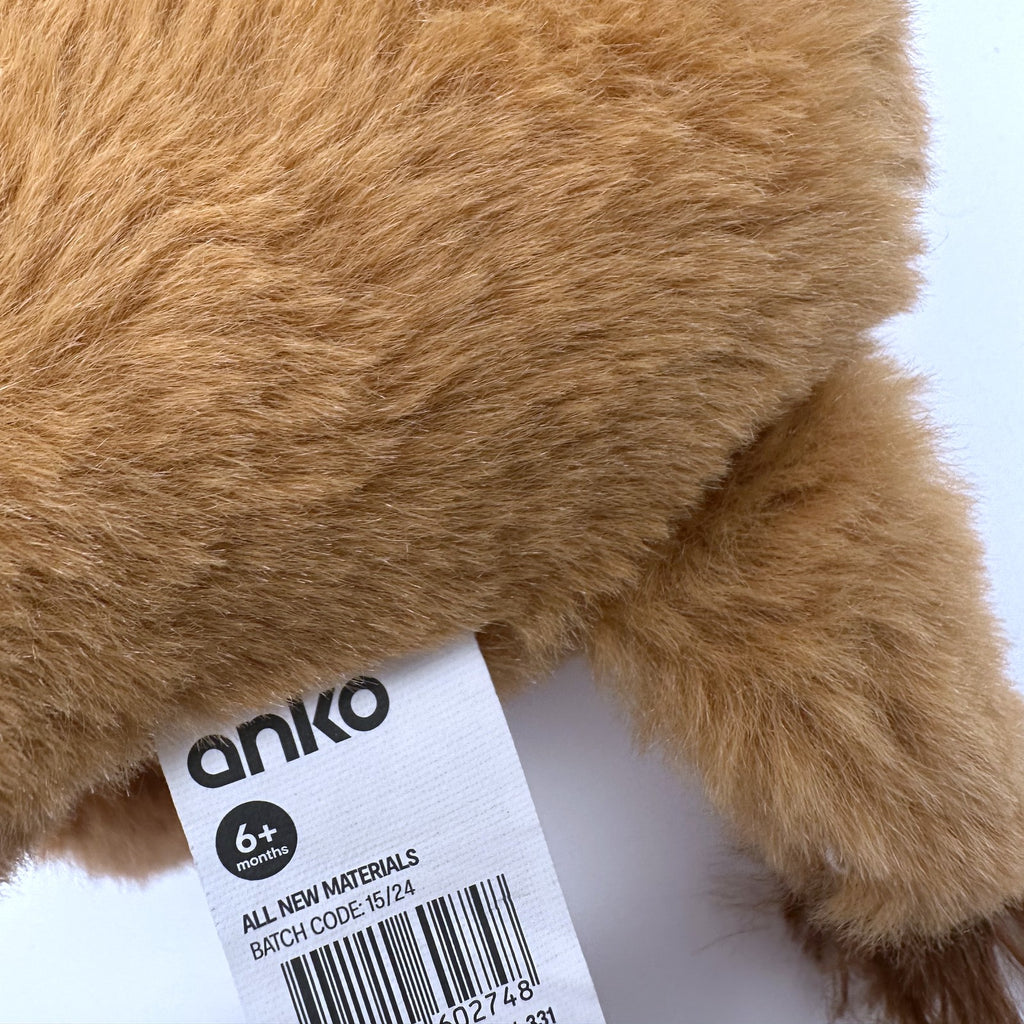 anko brand tag on golden lion plush