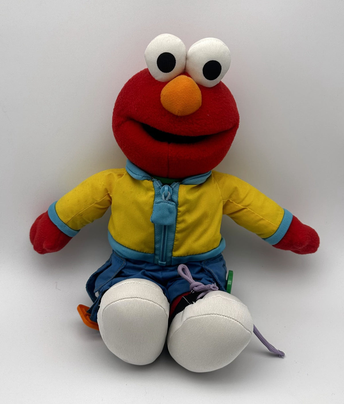 Learn to Dress Elmo · zips, laces & buttons