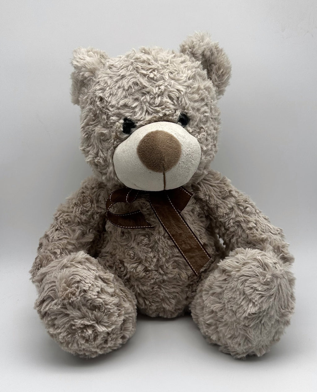 Grey Curly Teddy Bear · brown ribbon